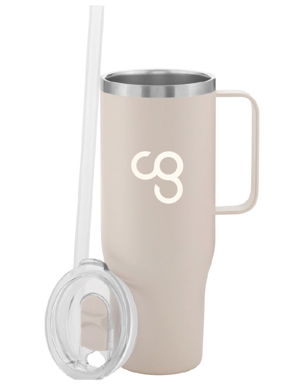 A beige stainless steel straw cup with a handle and a clear push-on lid, accompanied by a flexible silicone straw. With a white CG logo in the middle.