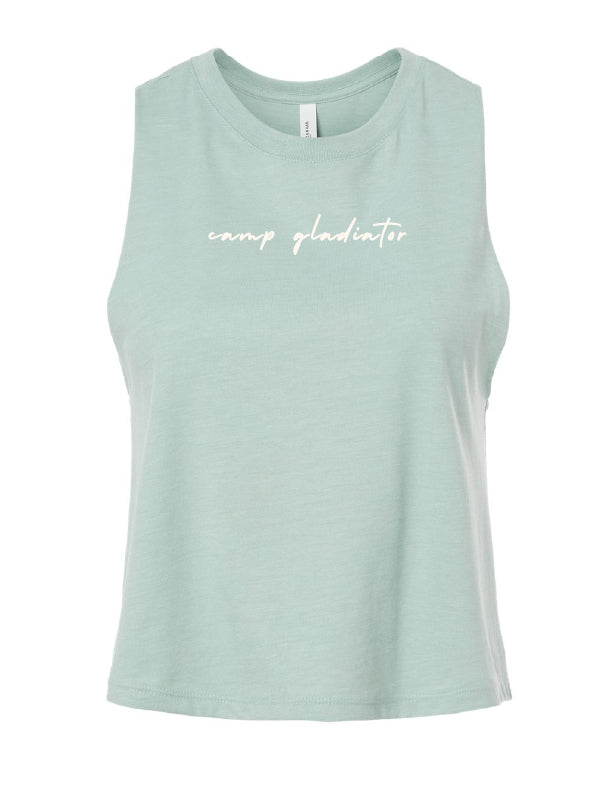 A dusty blue racerback cropped tank top with the text 'camp gladiator' written across the front in script.