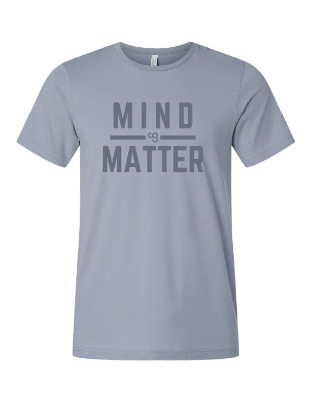 A vintage denim color  t-shirt with the text 'MIND MATTER' printed in a bold, capital letters font in the center. With CG logo between the words.